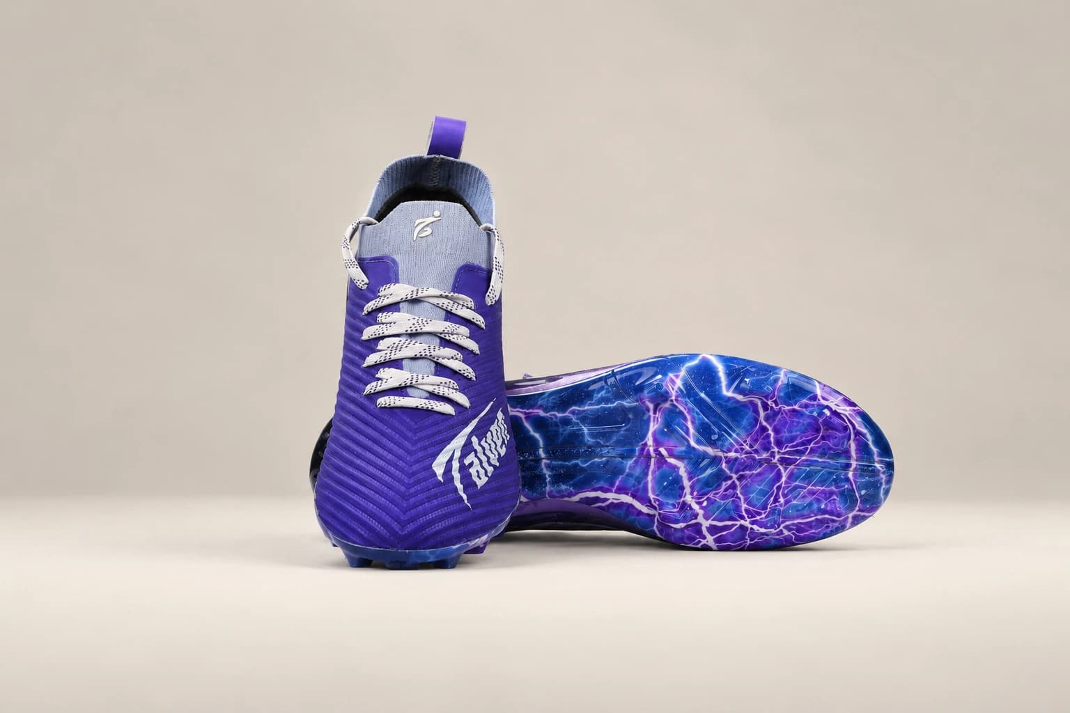 Stravion Purple pair, one boot turned to show the soleplate.