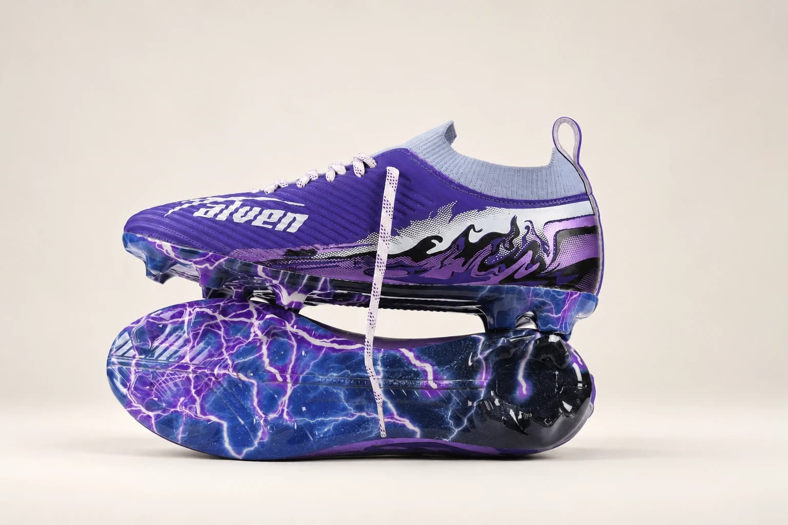 Two Stravion Purple boots stacked, the lower one showing the Phantom Skin outsole.