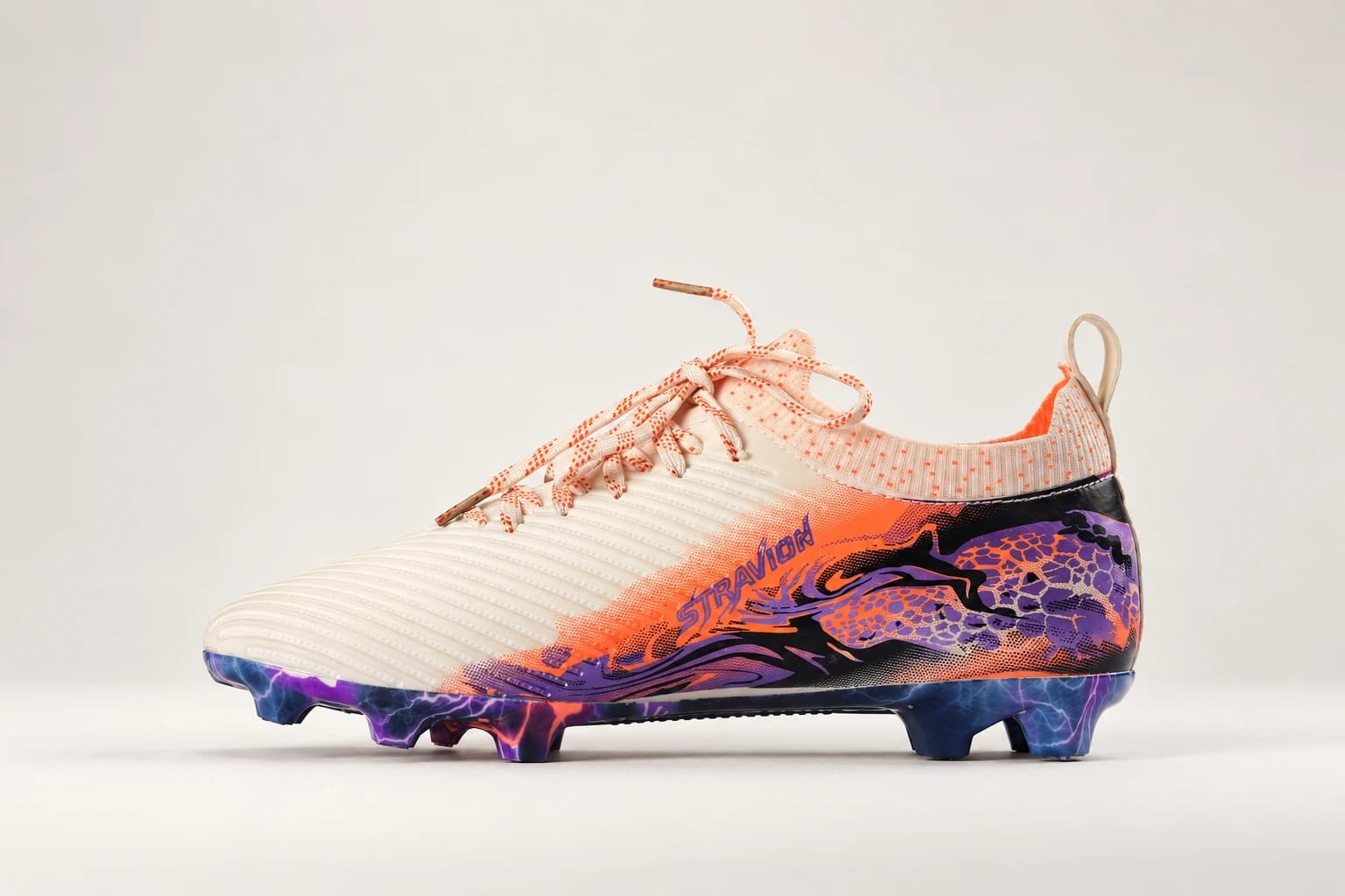 Stravion White, side profile: cream ribbed upper, orange flare and purple marbled sole.